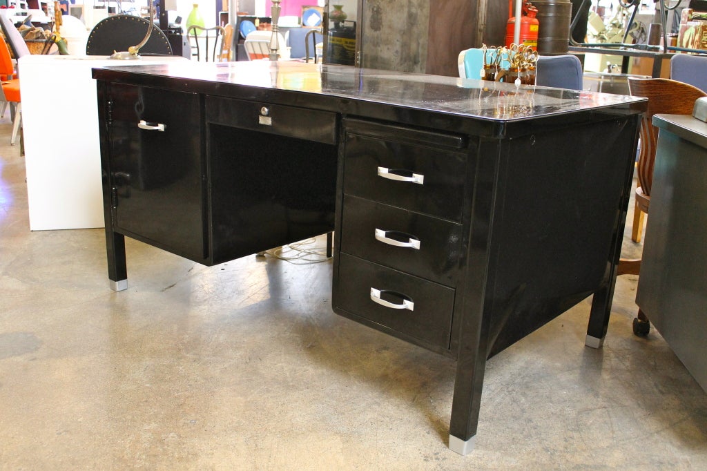 Executive desk with stowaway typewriter tray. Fairly rare.