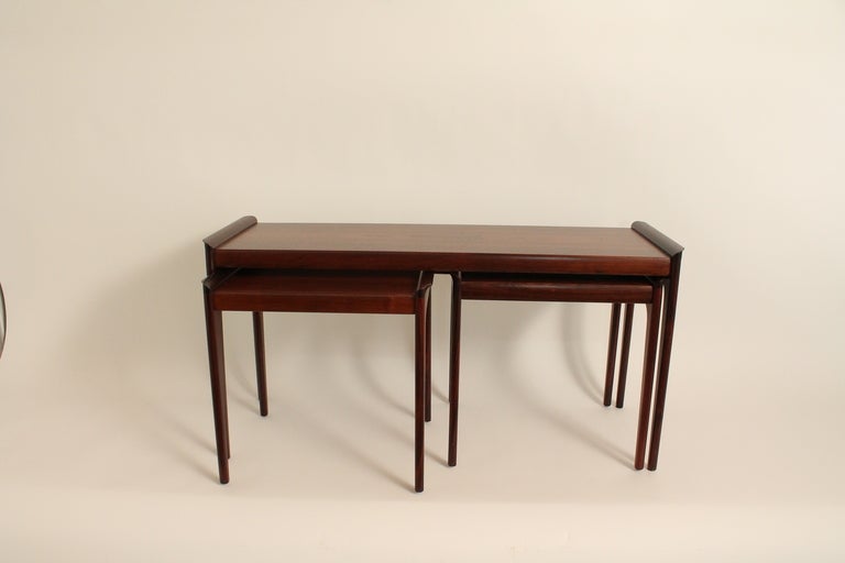 Vintage Danish set of rosewood nesting tables.
The two smaller tables slide into slots underneath the larger table.
Original labels.