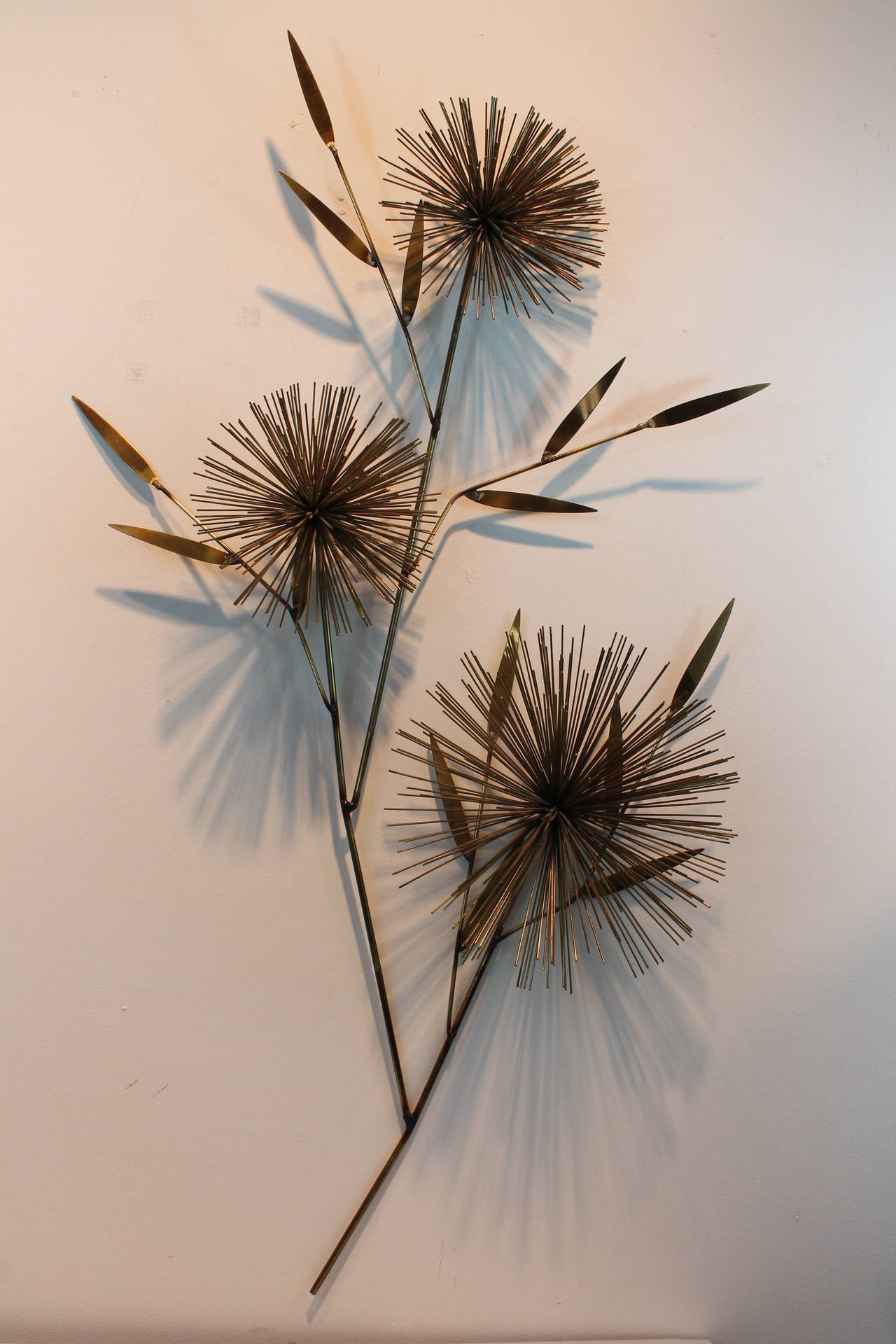 Great line and graphic form on this signed C. Jere brass pom pom sunburst flower form wall sculpture.