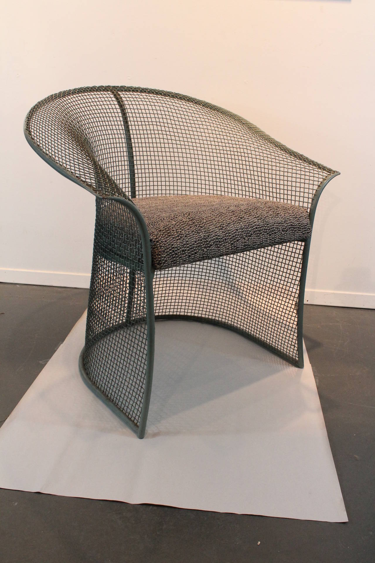 Rare Woodard Sculptura armchairs with the woven mesh being the leg and support structure.
