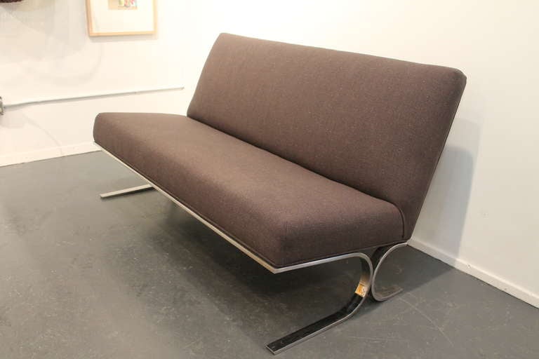 Strong and simple form on this minimalist chrome based 1970's settee.
Newly reupholstered in charcoal linen.