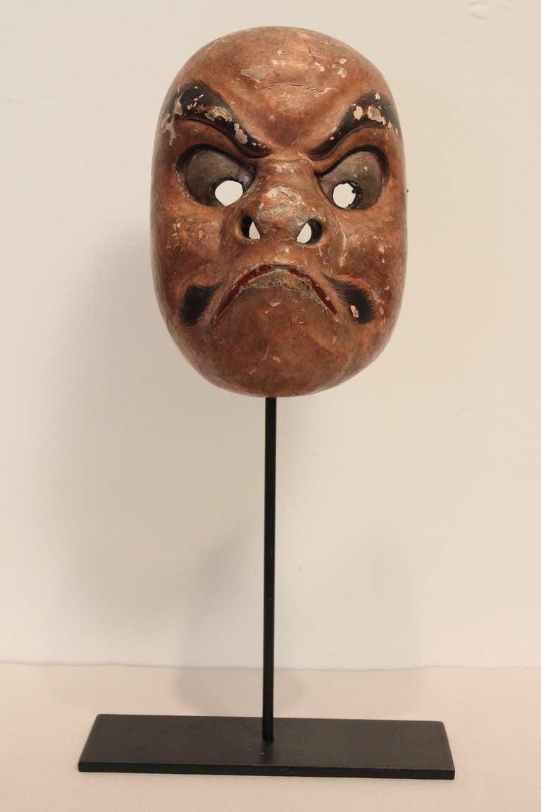 Great facial expression on this hand made Japanese Noh theatrical mask.
Fantastic surface and patina on this delicately carved and painted wood mask.