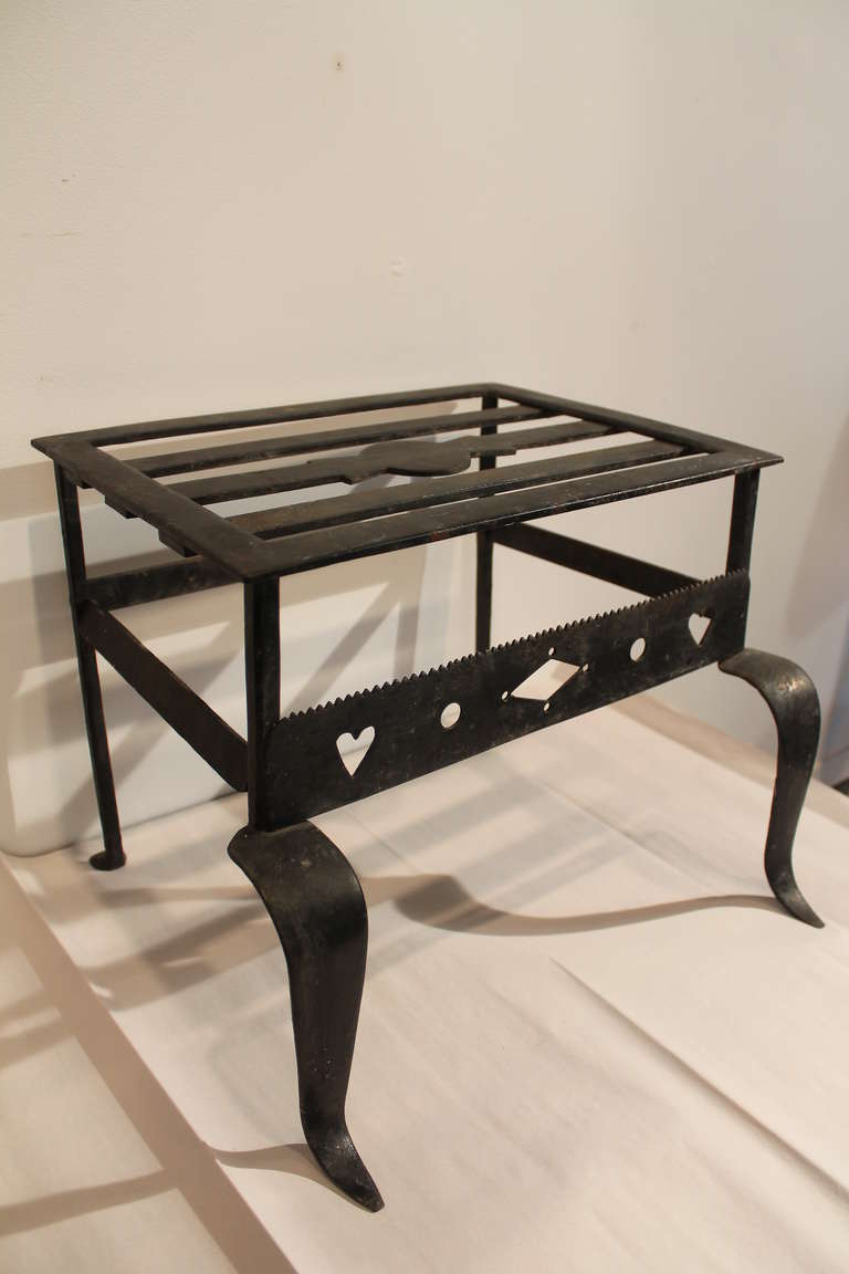 Hand wrought iron 19th century footman.
Used as a large pot and kettle stand in a kitchen near the fireplace.
Nice simple and graceful design.
Works great as an occasional table or stand.