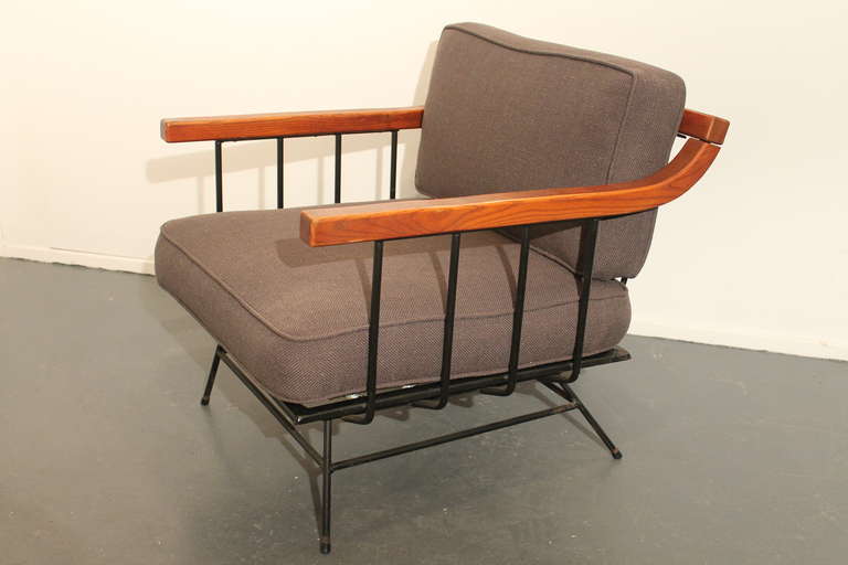 Great design in this 1950's arm chair.
Iron framed and oak arm and back rest.
Newly reupholstered in charcoal linen.