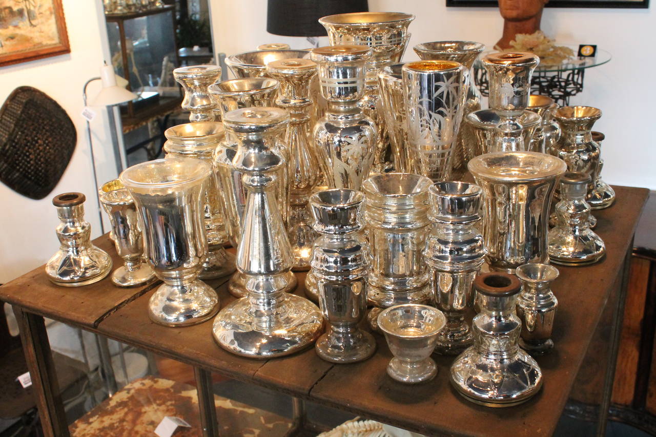 Great 40 year collection of 19th century mercury glass vessels. There are 41 total pieces, there are vases, candle stands and small bowls. Some are painted and some are etched.