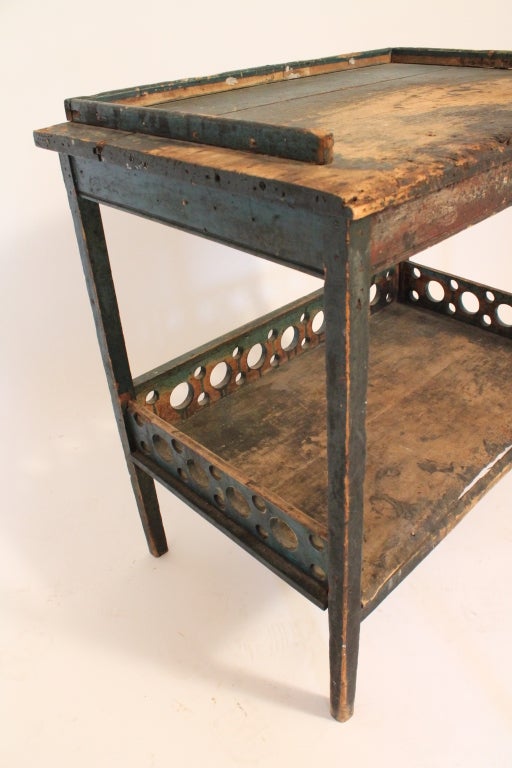 This table has a perfect primitive beaten surface. It shows all the signs of heavy use , either from a cobbler , or some other workman for years and years , yet has an elegance , detail , and proportion of a Modernist piece. It 's surface is