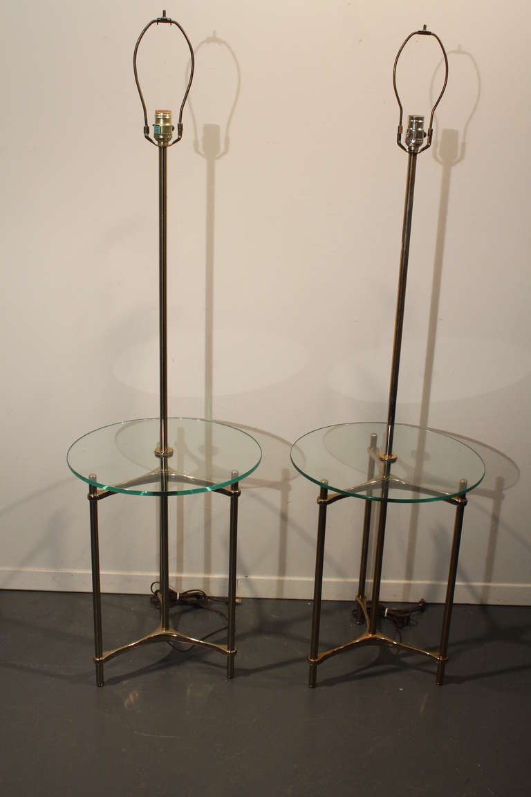 Great sculptural minimalist pair of floor lamps from the Laurel Lamp Co. Featuring a polished brass triangular tripod based table with a round 3/8