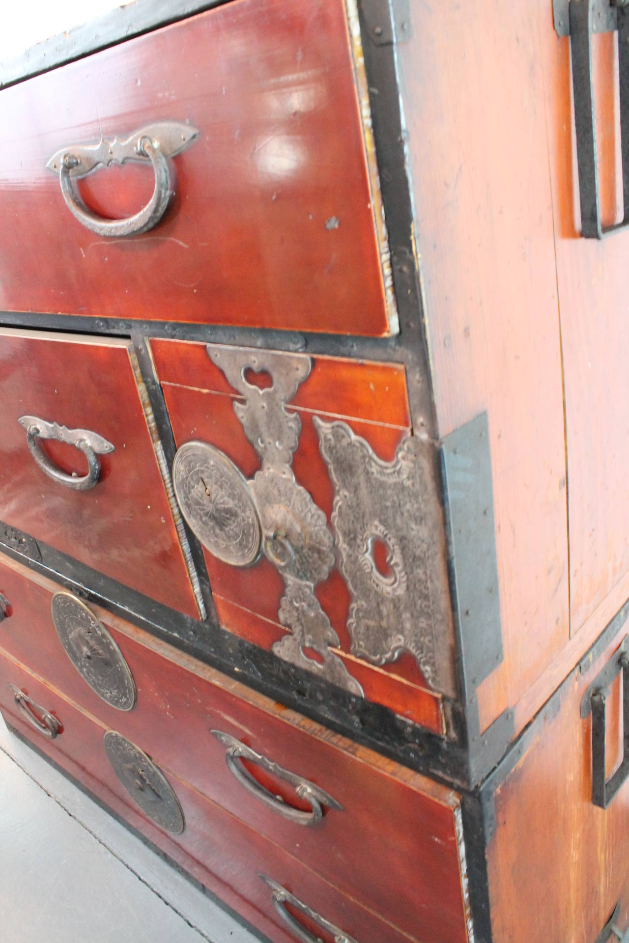 An exceptional Japanese two sectional clothing chest (isho kasane dansu) from the Sendai region, north of Tokyo. The sugi (cryptomeria) tansu with rich translucent red lacquer finish features two pieces that stack onto one another.
Could be divided