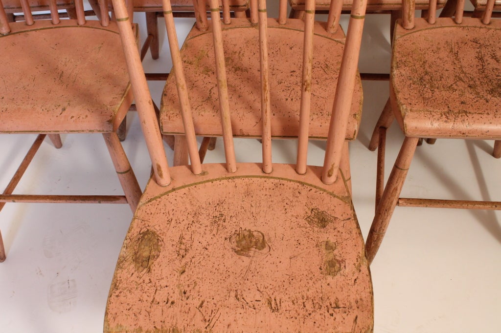 Set of 8 simple yet elegant painted and stenciled country pine chairs. Wonderful patina and color.