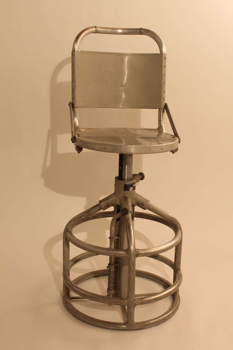 Fantastic sculptural adjustable stool manufactured by Hardman Tool & Engineering. It is Model # 617.
This Los Angeles company produced the boots used by the  Apollo astronauts when they walked on the moon , as well as commercial airline seats. They
