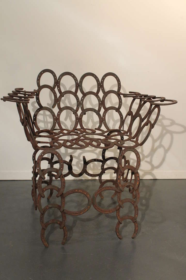 Great graphic welded folk art horseshoe armchair.
Very sturdy and fun.