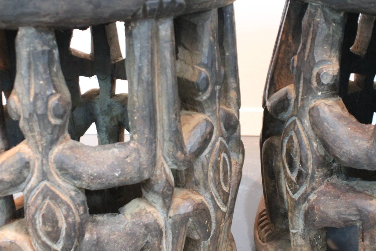 Pair of graphic hand-carved Bamileke lizard stools from Cameroon.