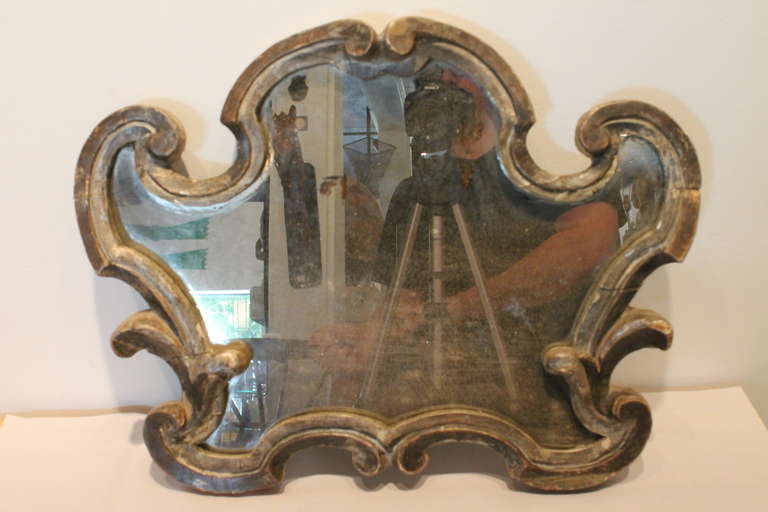 Fantastic line and dimension on this graphic Italian carved and silver leaf mirror.
Fantastic surface and form!!!