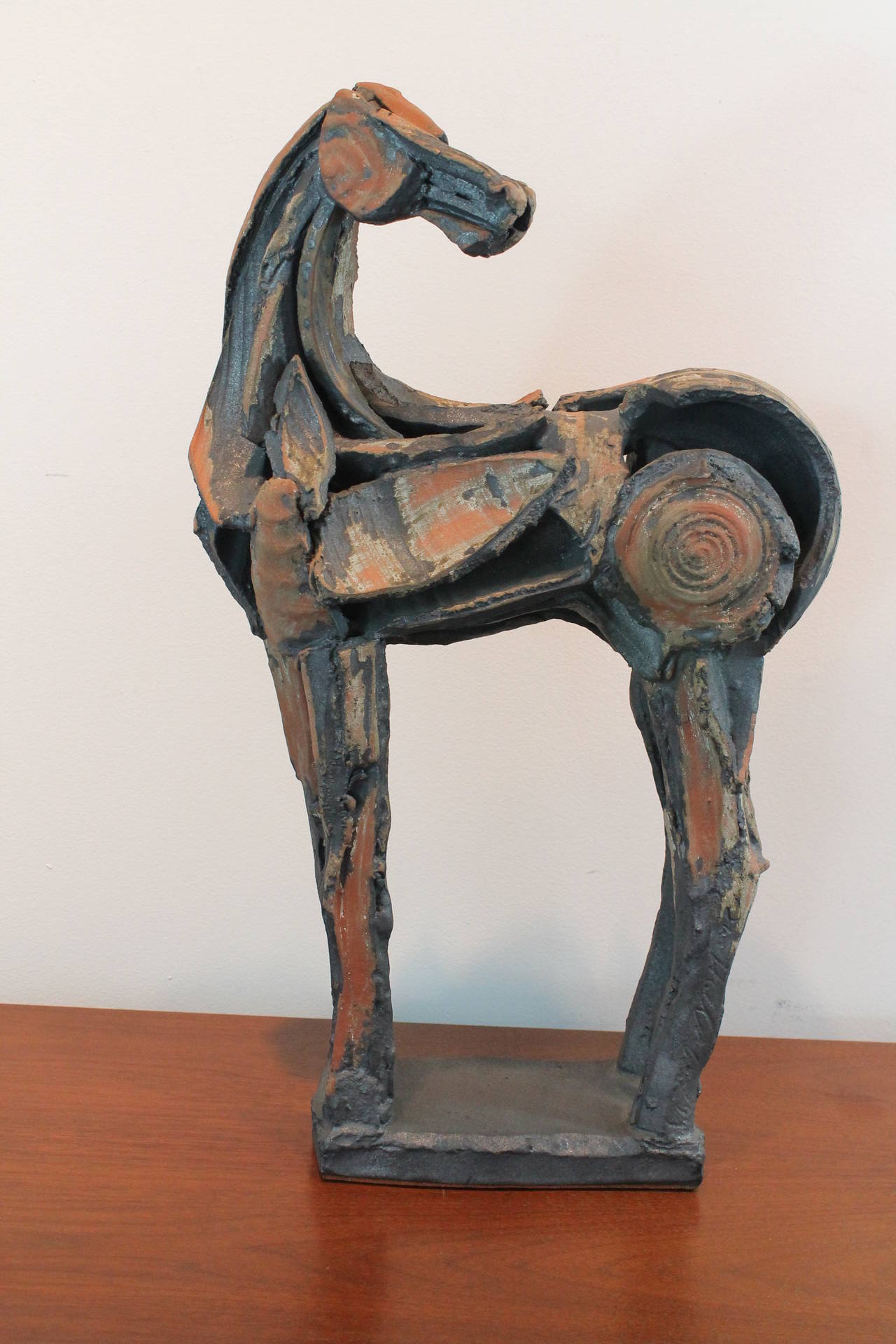 Exceptional and unusual form and construction on this Mid-Century Modernist horse sculpture.
Formed from an assemblage of ceramic shards.
Great from every angle.
Signed illegibly on the rear left leg.