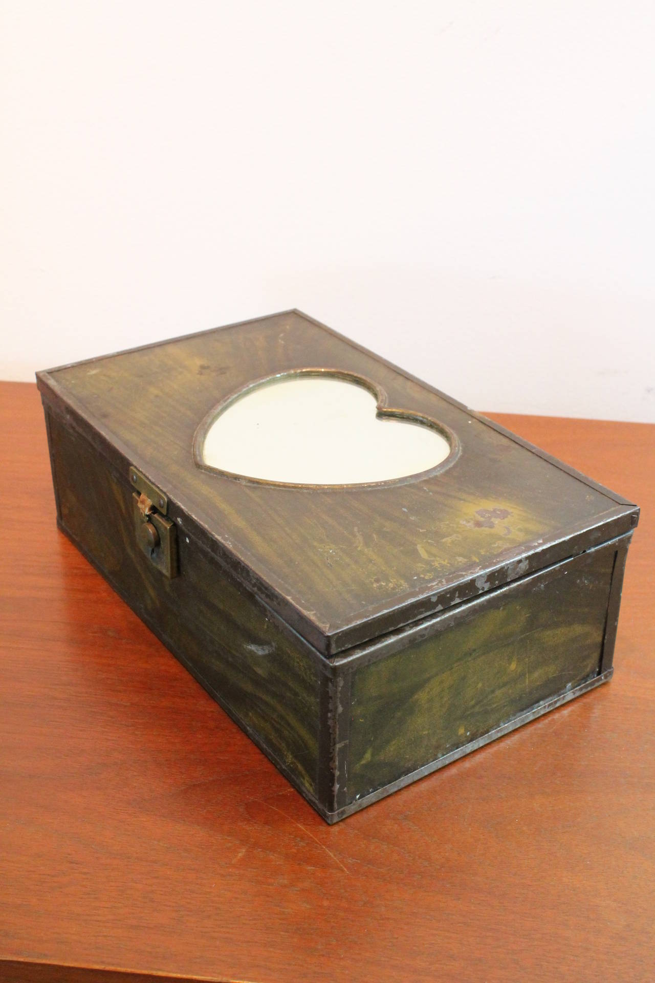 Tole faux grain metal box with a heart shaped mirror on the top.