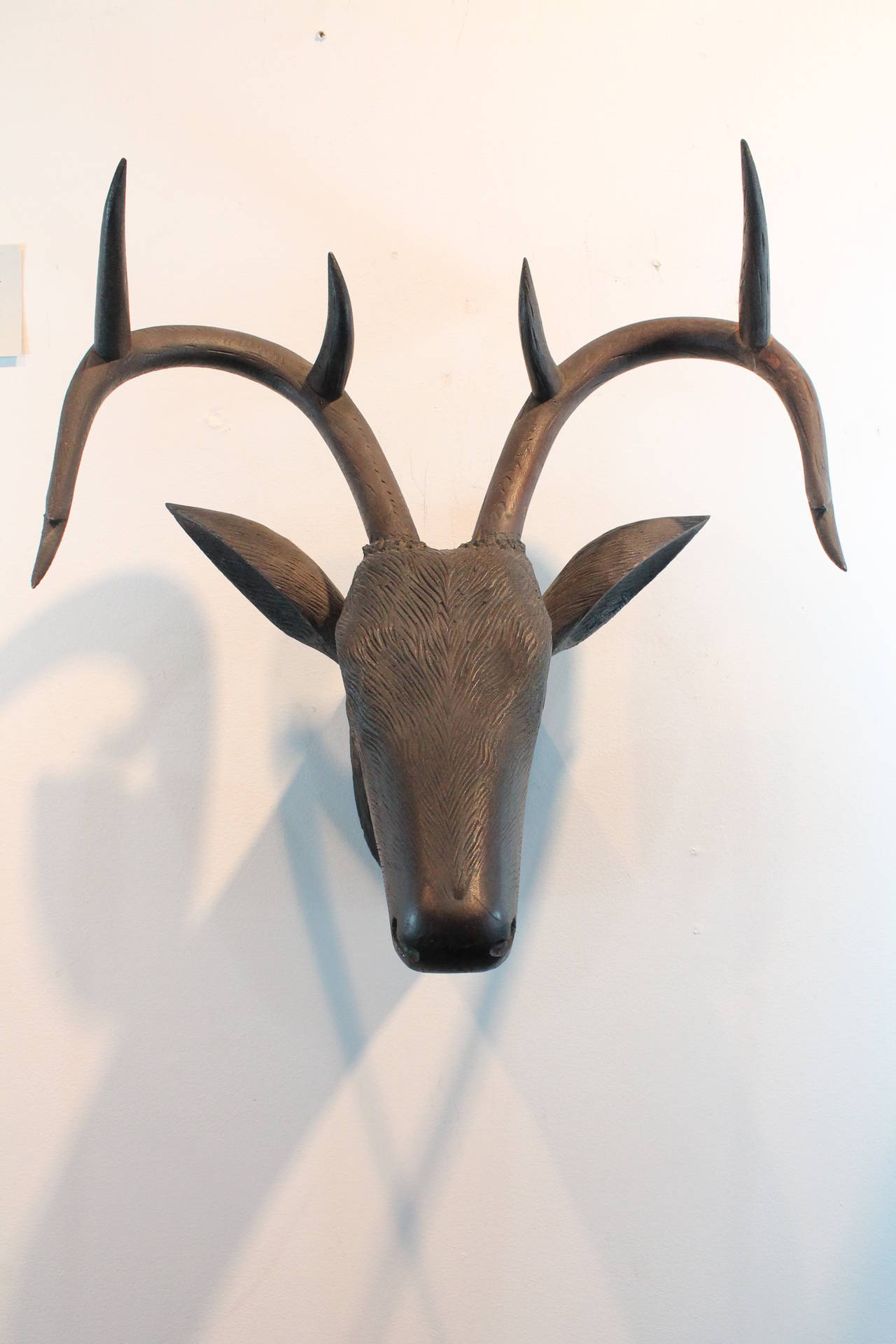 Great form and presence on this carved Black Forest stag.