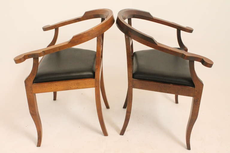 Wonderful design on these pegged 19th century arm chairs.Simple and elegant lines. They have a great beaten and worn surface and are comfortable. 
One is slightly lighter than the other , as can be seen in image 2.