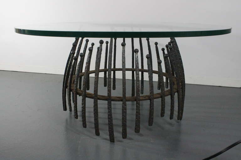 Great sculptural form on this forged iron Brutalist cocktail table.