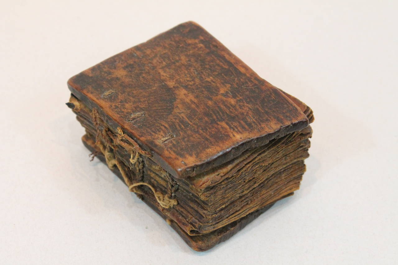 A fascinating object of spiritual discovery. The covers are very well worn wood with the vellum pages held together and to the cover by a woven natural rope.
Written in Ethiopic (Ge'ez), a Semitic language that is no longer spoken, but is still