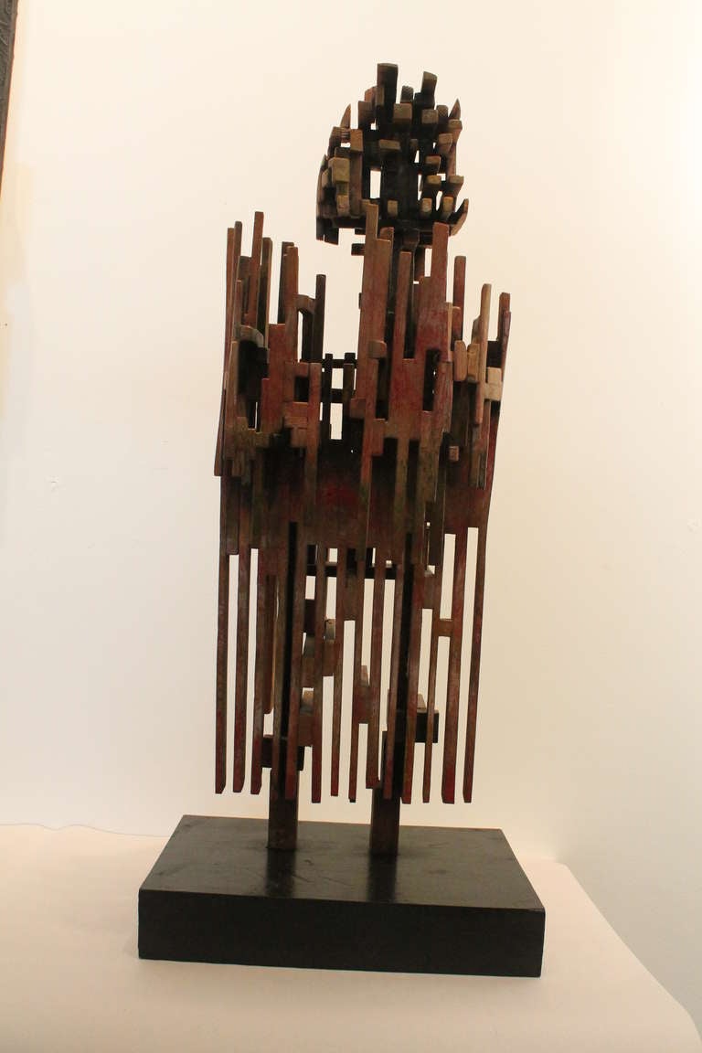 Wonderful Cubist inspired angular constructed Modernist figurative sculpture.
Large scale and with tremendous presence.
Exception construction of dozens and dozens of individual painted and distressed wood fragments in the form of an abstracted