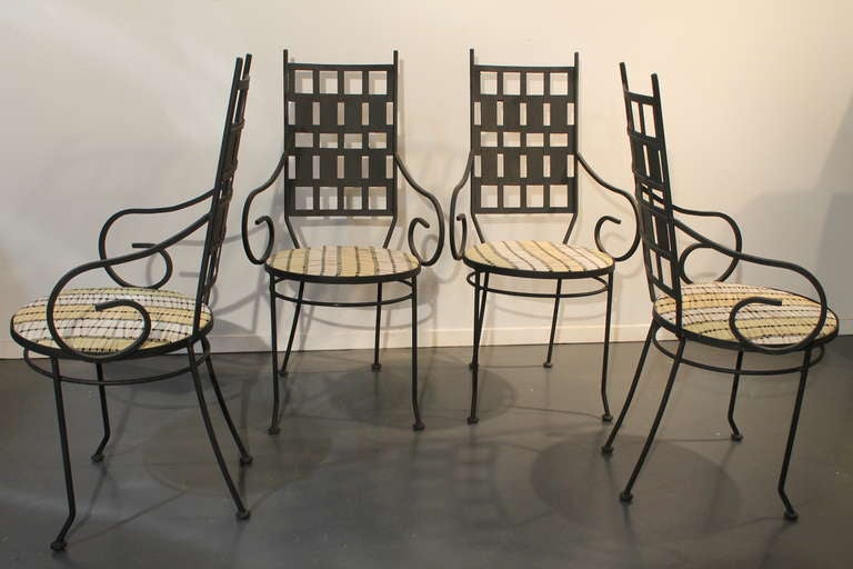 Very clean and newly reupholstered set of 4 Salterini iron garden chairs.