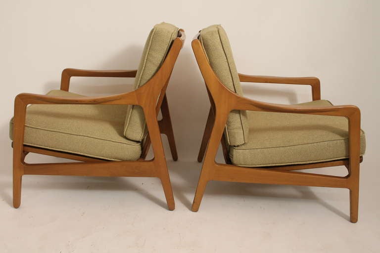 Pair of sculptural and very comfortable Danish lounge chairs from the 1950's. They are each marked with a 