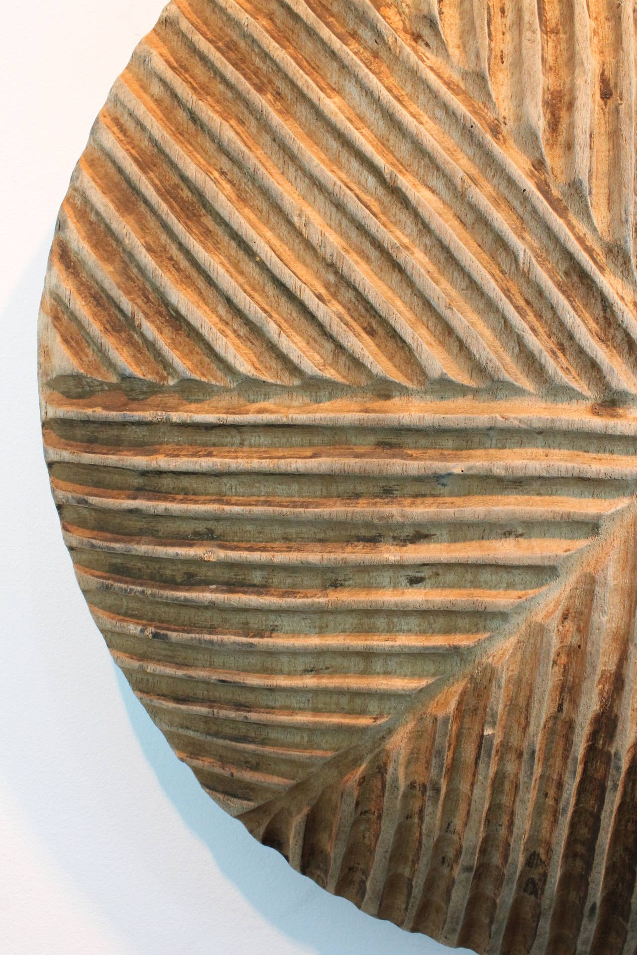 Wonderful graphic carved Congo shield.
Exceptional patina and form.
The design consists of a series of carved parallel angular gouges played against each other.
The form of the shield is bowed , not flat. The center is deeper than the edges.