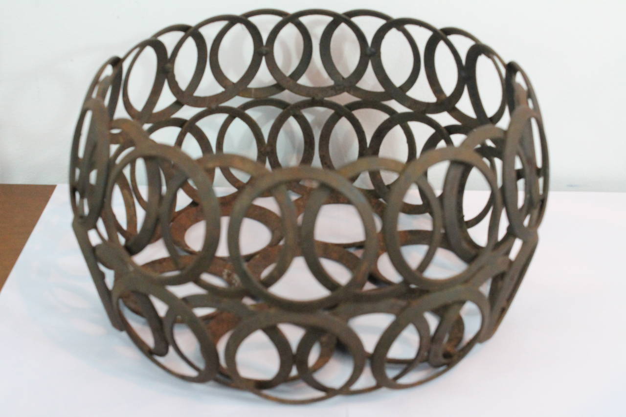 Ingenious primitive yet sophisticated bowl constructed of iron rings welded together .
Captivating form.
Great Modernist sensibilty.