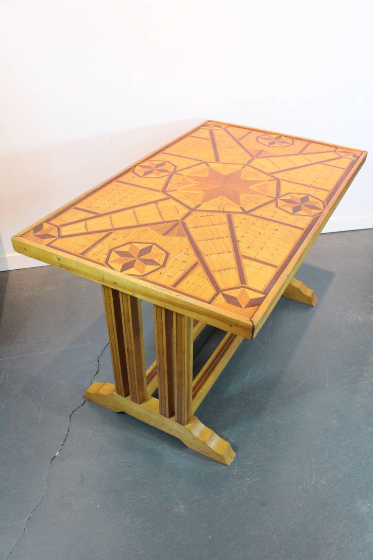 Wonderful detail and design in this American Folk Art graphic star designed marquetry matchstick table.
This form of construction is often believed to be prison work.