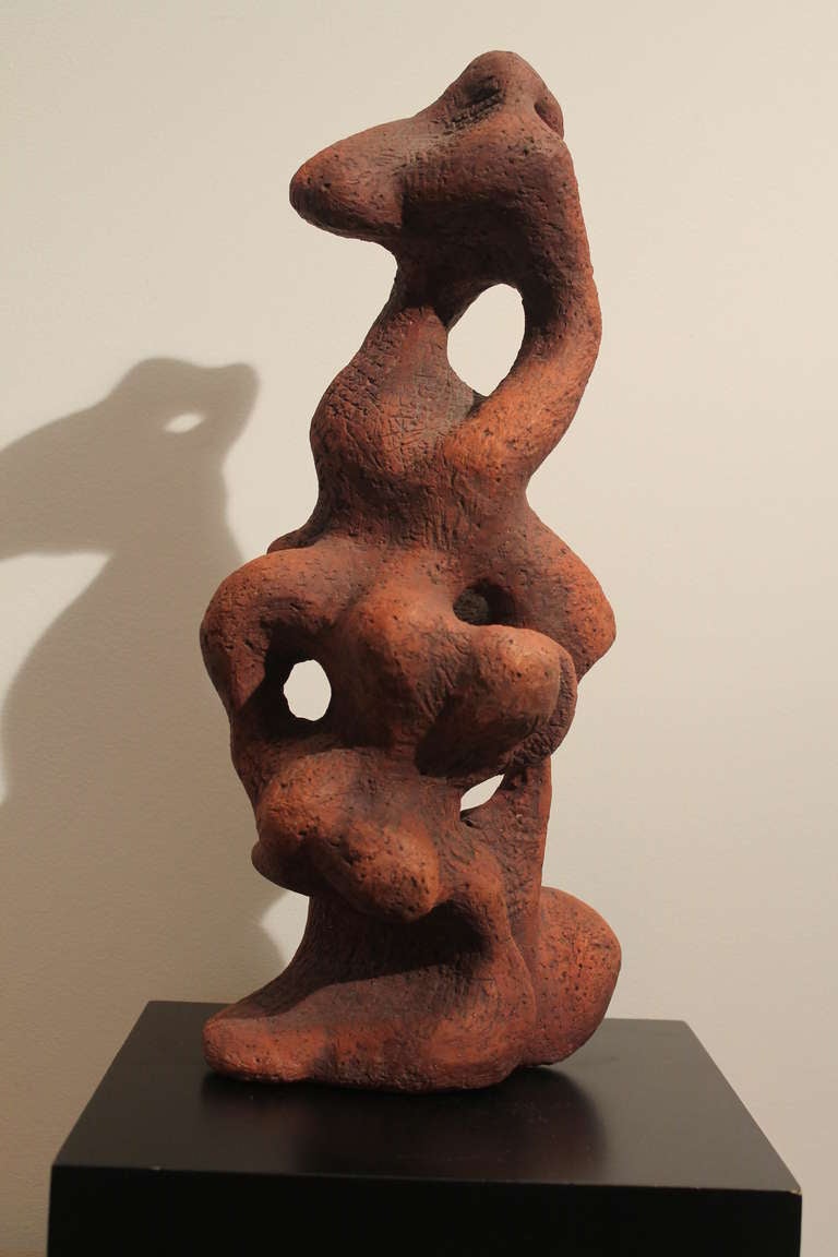 Great fluidity and form in this studio art abstract ceramic sculpture from the 1950's.
Free standing , not attached to the base it is photographed with.