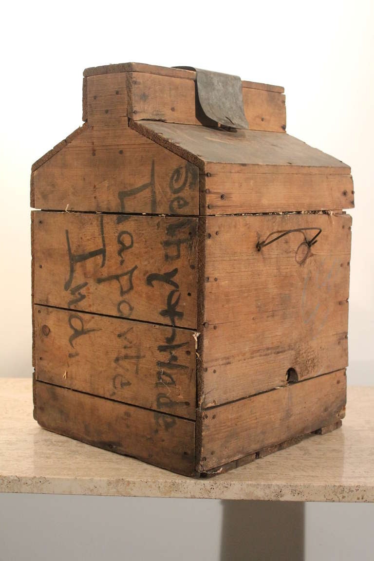 Great primitive form on this 1905 Demijohn crate.
Great surface.
A handmade hinged top allows access to the bottle without removing the top.
Painted on the side La Porte , Indiana.
Bottle not original.