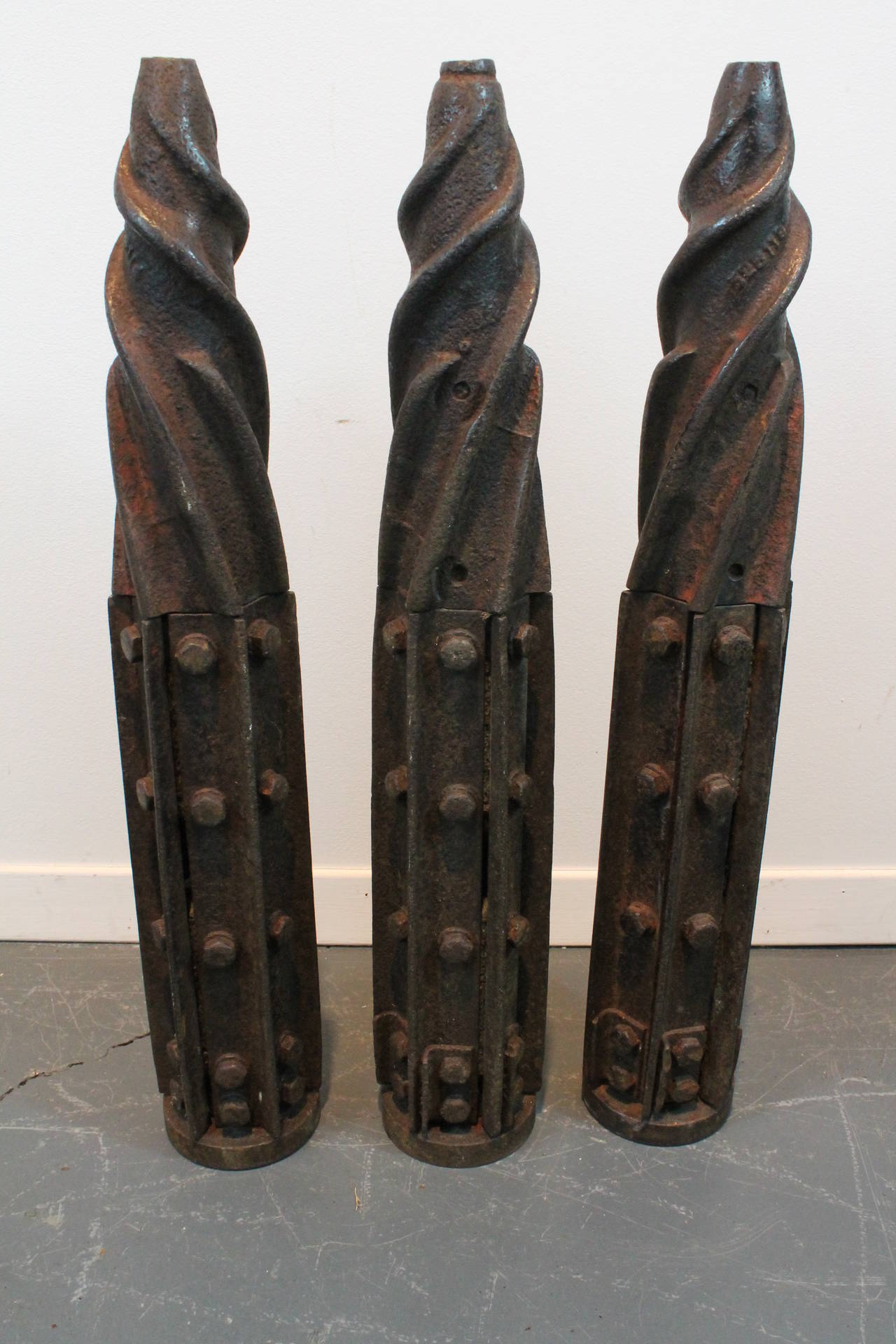 Great patina and form on these early 20th century cast iron drill forms.
Their drill portion is hollow and has a hole at the top of each that is 4.5