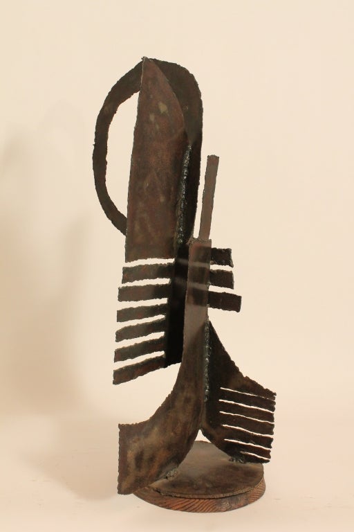 Wonderful Graphic Steel Brutalist Moderne Sculpture by David Ford Studios.
He has been commissioned to do sculptures by Johnny Carson, Ed McMahon, George Peppard, Charleton Heston, the Lykes Family, Robert Wooten, the City of Fort Lauderdale, 