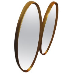 Pair of Hollywood Regency Oval Mirrors