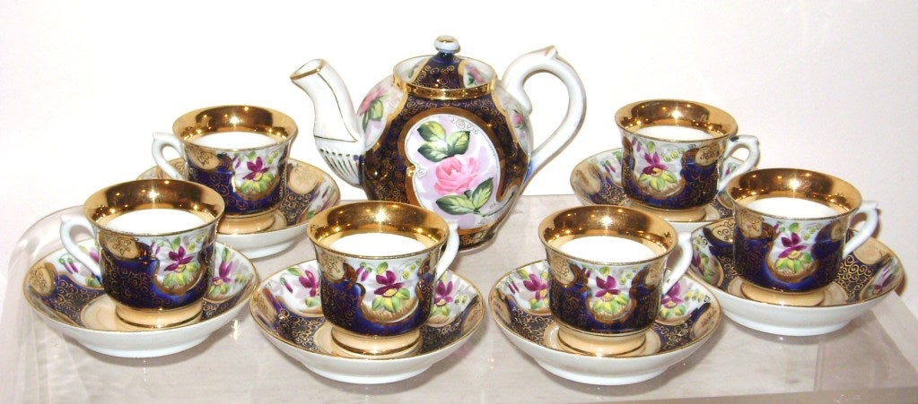 Antique 19 th c Russian Kuznetsov Porcelain Tea Service, handpainted and highly decorated in cobalt and gold.