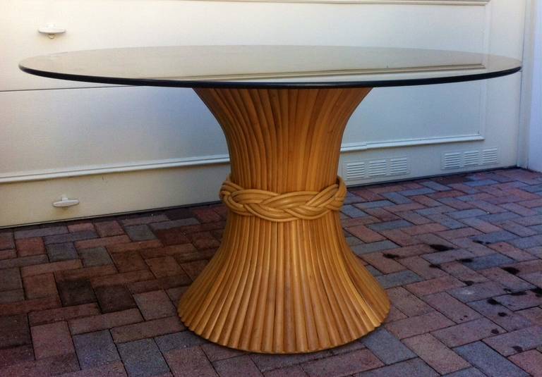 Elegant dining table, sheaf of bamboo attributed to McGuire with a thick glass top in black or clear glass of your choice. The black top pictured is 50