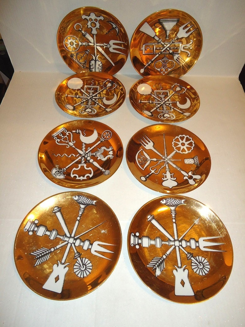 Set of 8 Gold Fornasetti Plates