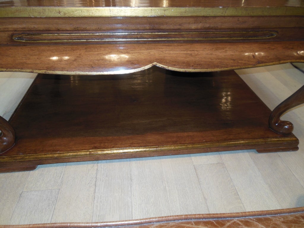2 tier cocktail table.  Hand carved walnut with 22K gold leaf accents.