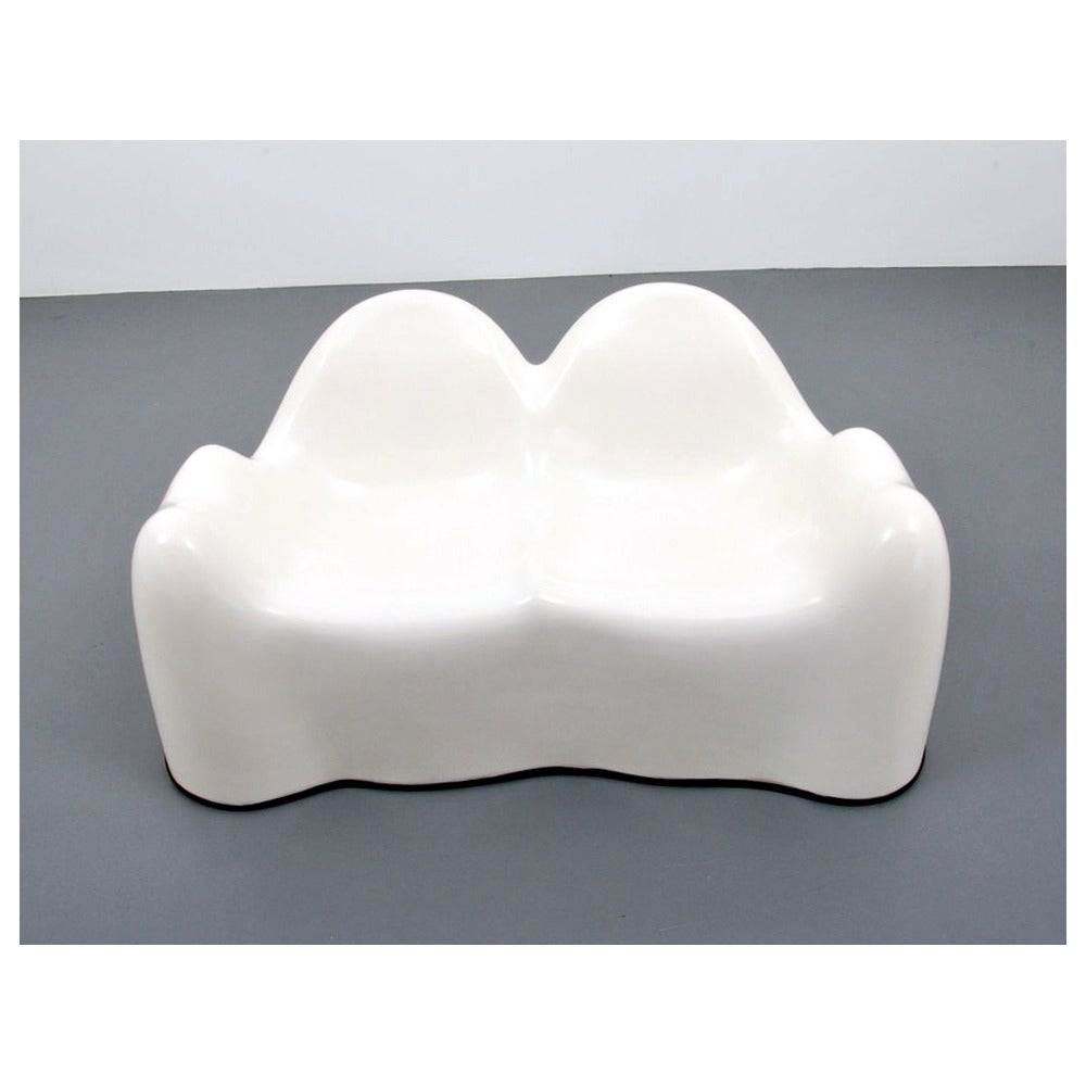 A molar settee or loveseat designed by Wendell Castle and manufactured by Beylerian, circa 1970s. The molar series is a playful design from Wendell Castle's versatile repertoire that uses the reinforced fiberglass to fulfill his vision in organic