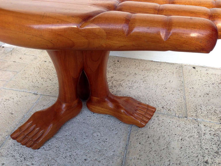 A stunning hand and foot table design and made by Mexican Surrealism artist Pedro Friedeberg in his iconic hand and leg motifs. Made of laminated and blocked mahogany, this table features a palm supported by three link legs with dowels joints.
