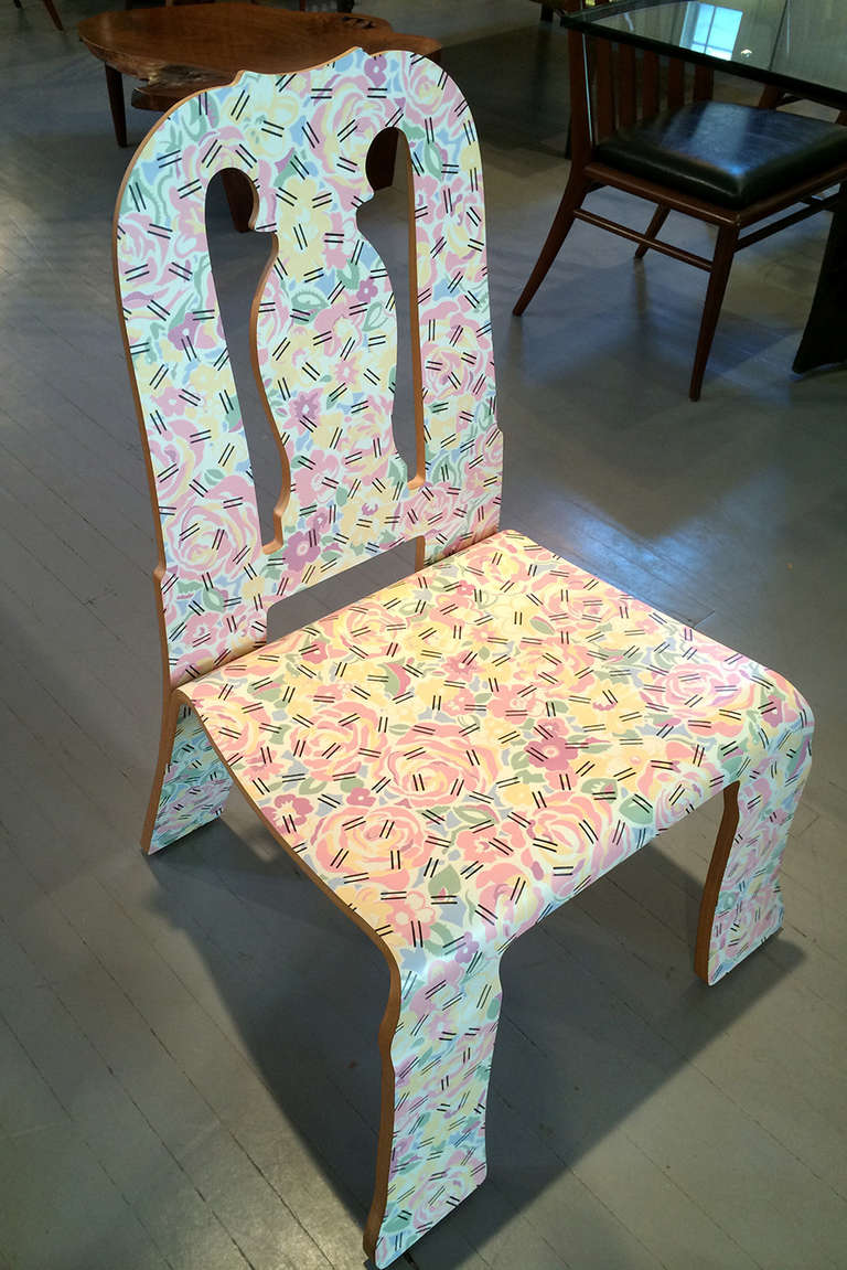 A collectible Queen Anne chair designed by Robert Venturi for Knoll International USA, circa 1984. it features the designer's reinterpretation of classic furniture using new technology the printed lamination over plywood. 
laminate over plywood.