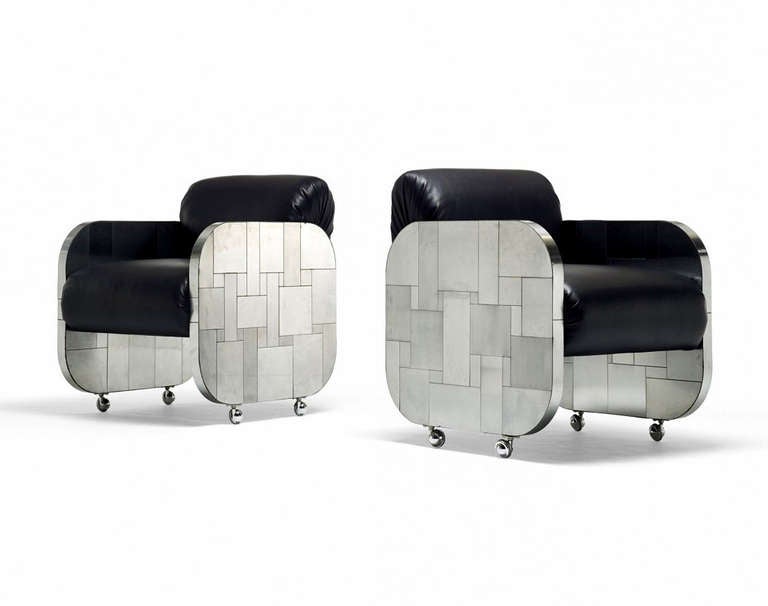 A very sleek and sophisticated looking pair of lounge chairs with arms designed by Paul Evans for Directional, circa 1970s. They are constructed with patchwork steel plate frames in a subtle contrast of polished chrome and satin nickle finishes.