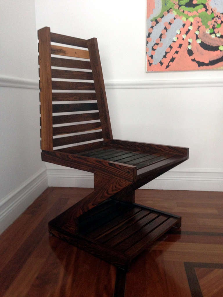 A very sculptural and rather rare zig zag chair by celebrated Mexican designer and woodworker Don Shoemaker, model no F52. Designed in 1970s and executed in 1981, the chair is constructed with patchwork of exotic Cocobolo wood, a tropical hardwood