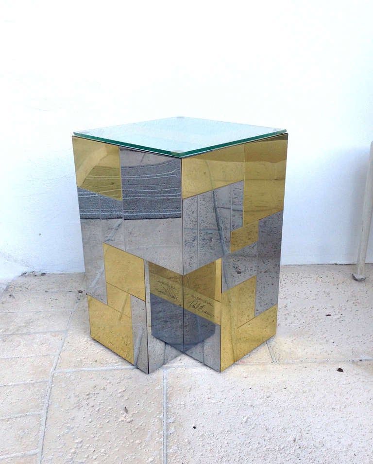 A small side pedestal table by Paul Evans for Directional circa 1970s. Cityscape series with chrome and brass patchwork and a cutout design on the base. Signed with plague 