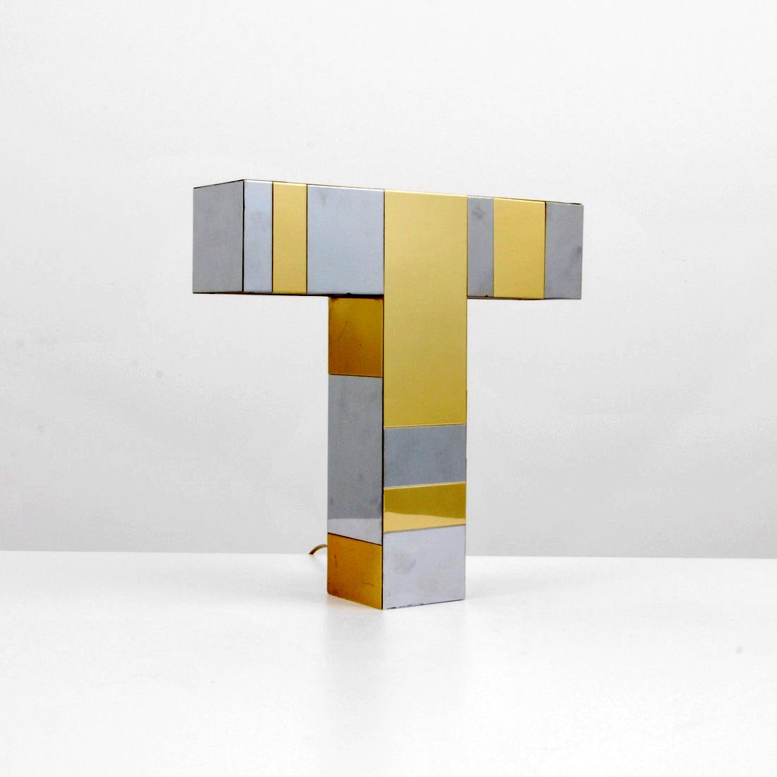 A table lamp in Cityscape series designed and made by Paul Evans for Directional circa 1970s. In a minimalistic cubic letter 