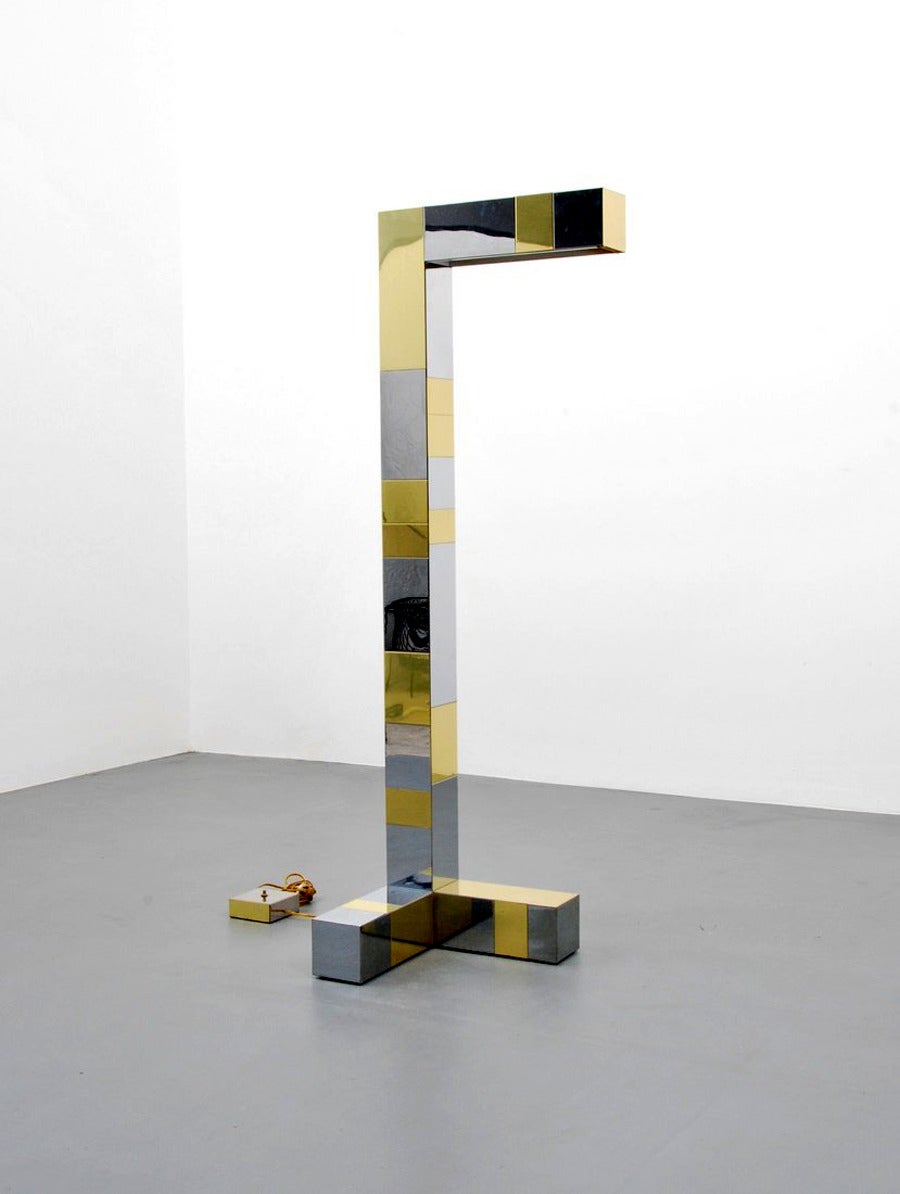 A floor lamp in Cityscape series designed and made by Paul Evans for Directional, circa 1970s. In a minimalistic cubic form with chrome and brass patchwork surface, the lamp is one of several designs Paul Evans made for Directional in 1970s. Model