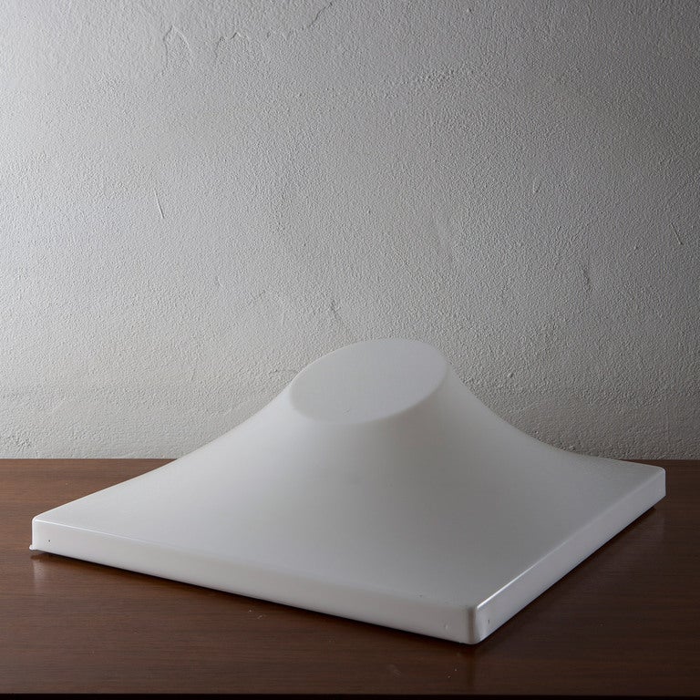 Big sculptural table lamp by Ennio Chiggio for Emmezeta.
The combination of the 3d shapes and the material make it as much objects of arts as functional lights.
Original manifacturer catalogue available shows that the same piece was designed by