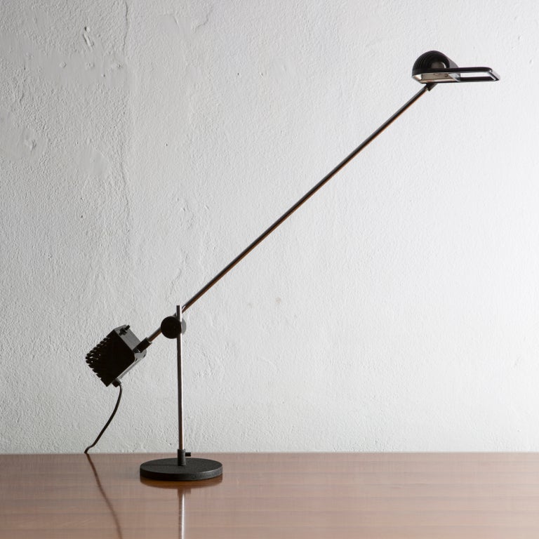 Maniglia (handle) table lamp by Jonathan De pas, Donato D'Urbino and Paolo Lomazzi for Stilnovo.
Balanced structure with chromed elements, can move in all directions.
One of the most significant example on minimalist lamp of the Seventies Italian