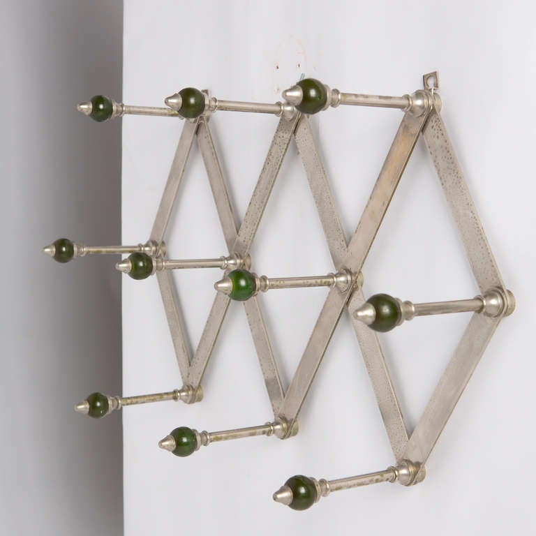 Expandable coat rack by Luigi Caccia Dominioni for Azucena.
Pantograph frame and resin green balls.