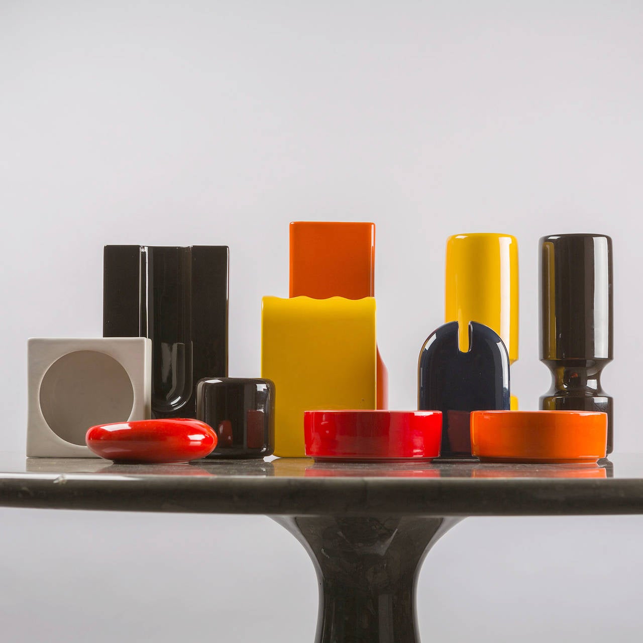 Rare set of 11 ceramic centerpieces by Angelo Spagnolo for Sicart.
Different sizes and mirrored black, white, red, yellow and orange glaze with original paper labels/marks to base.
The measurements refer to the bigger piece.